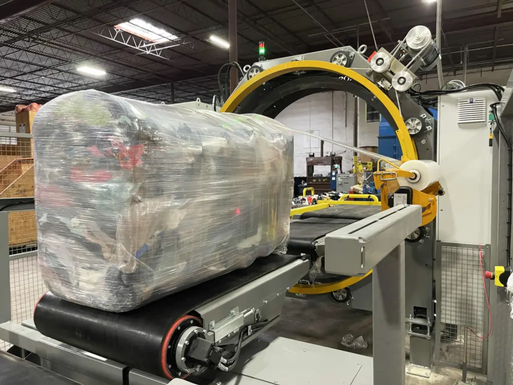 On Image: Textile bale wrapping process with Bale Wrapper