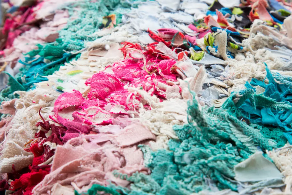 On Image: Fabric scraps old clothing and textiles are cut into strips